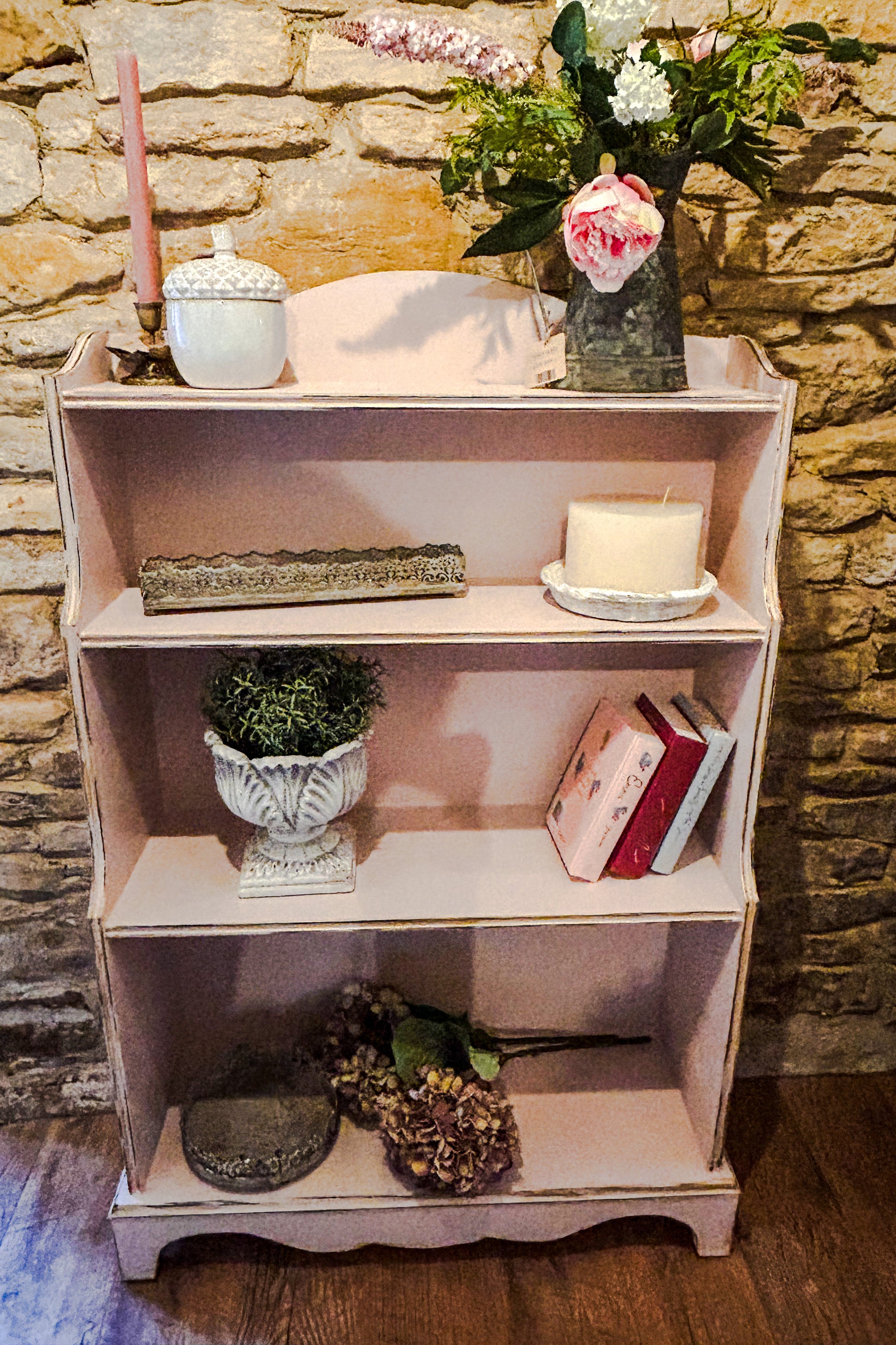 Bookcase in pale pink 