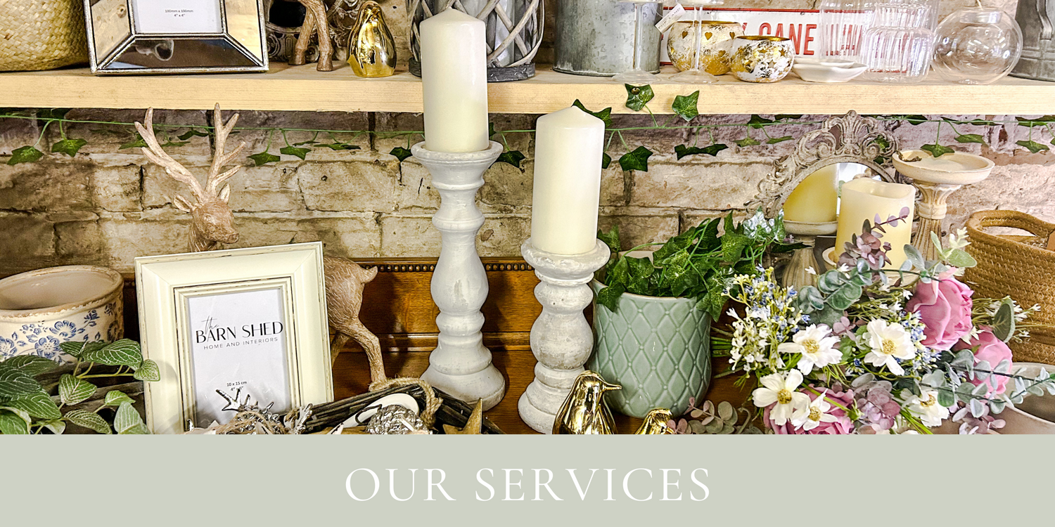 The Barn Shed shop with candles, flowers and home decor items scattered